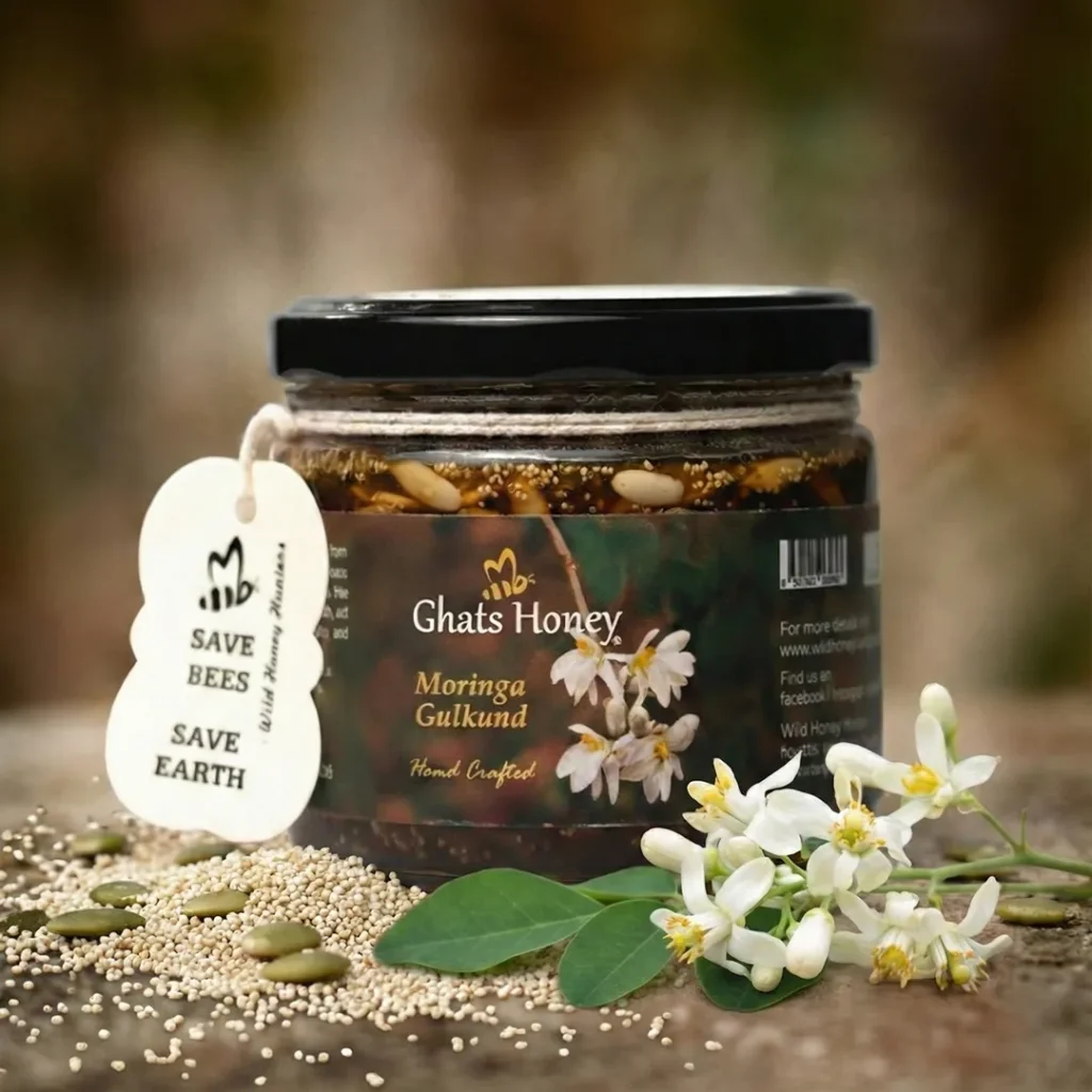 ghats moringa gulkand jar in natural backround surround with moringa flowers, poppy seeds, and leaf