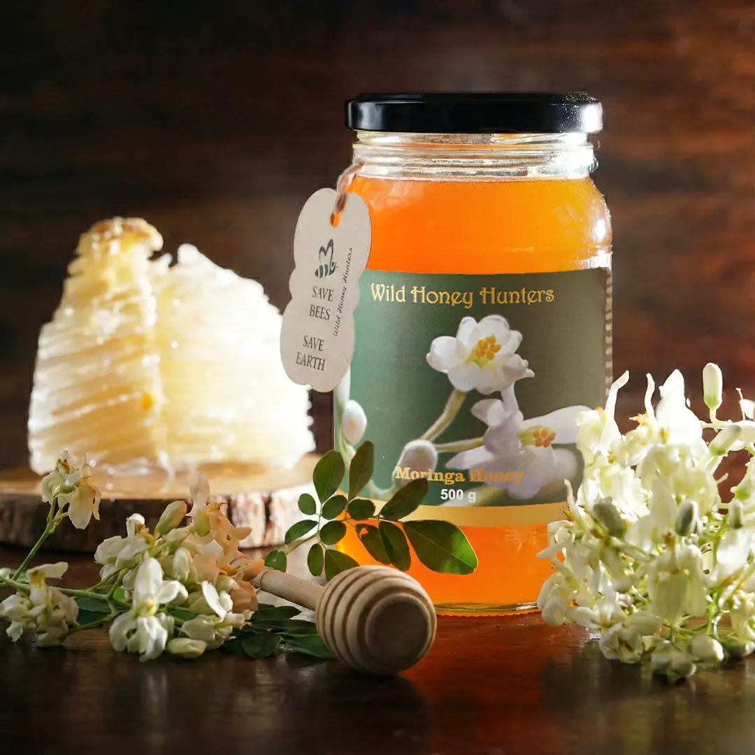wild moringa honey bottle with natural honey comb