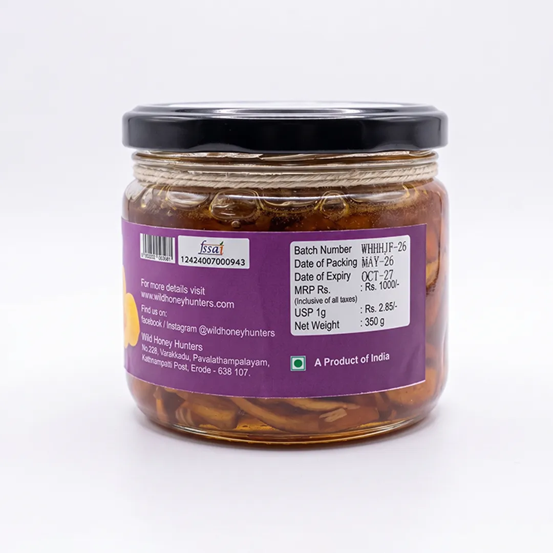 Back view of Ghats Honey with Jackfruit jar showing product information, FSSAI details, batch information, and packaging label on a purple background.